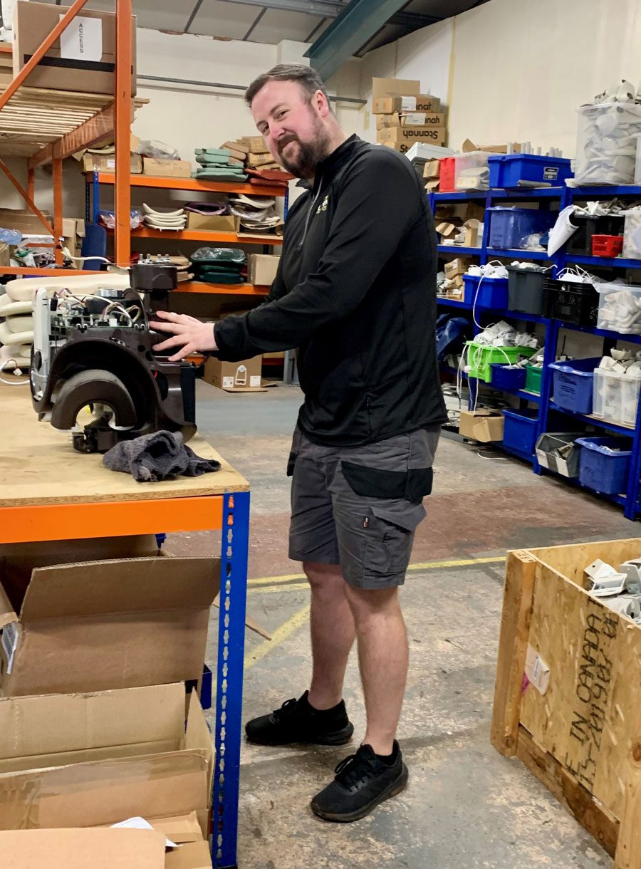 Neil in the warehouse at Dolphin Stairlifts in Devon