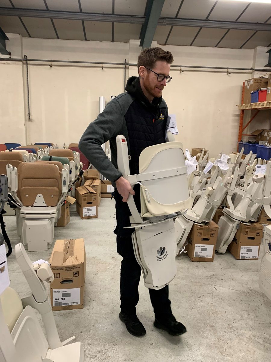 ben-carrying-lift-in-warehouse - Dolphin Stairlifts Devon